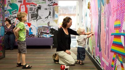 Parent and kids exploring the Museum of Australian Democracy
