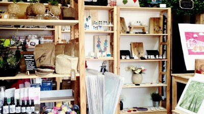 Wooden shelves full of jewellery and homewares.
