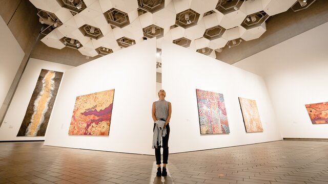 A woman gazing at art.