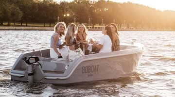 A group of friends enjoying their time on a GoBoat on the lake.