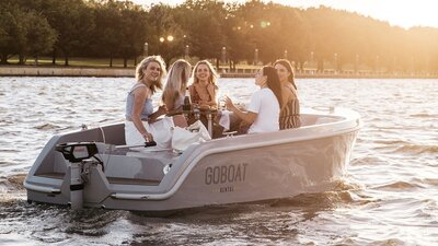A group of friends enjoying their time on a GoBoat on the lake.