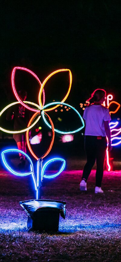 A few kids playing amongst the light sculptures at Enlighten Festival.