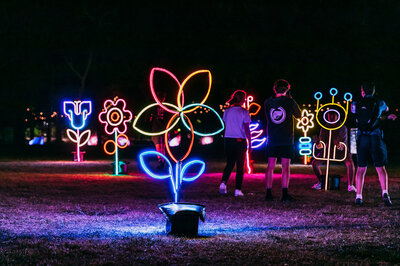 A few kids playing amongst the light sculptures at Enlighten Festival.