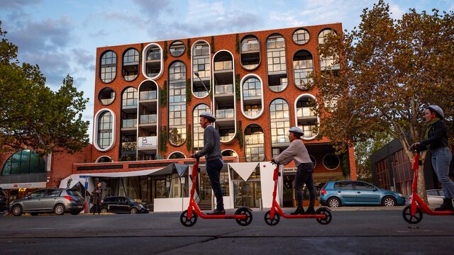 People riding scooters in Braddon