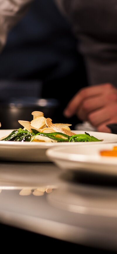 Chef plating food at Aubergine