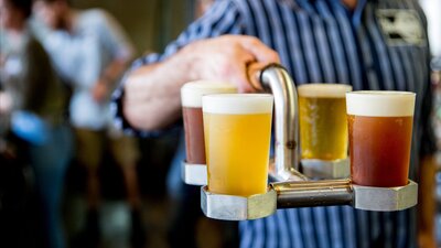 Person carrying beers at Bentspoke Brewing Co