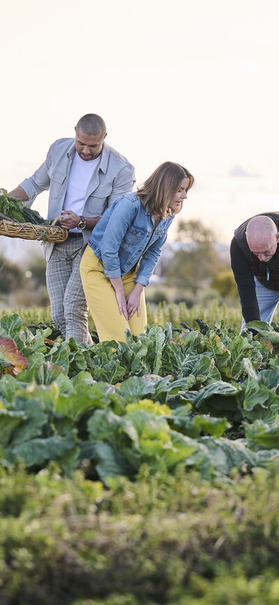 A young couple on a tour through the vegetable garden beds at Pialligo Estate Canberra.