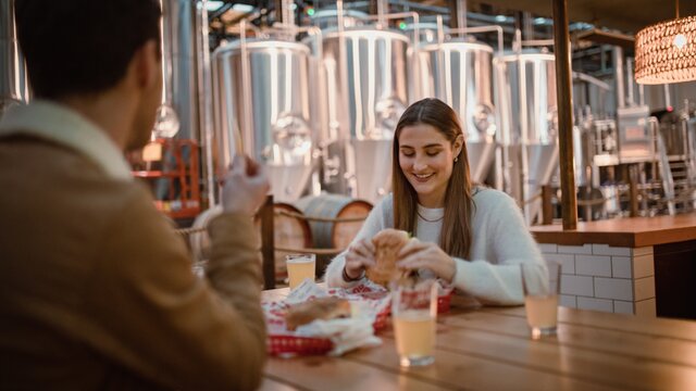 Patrons eating burgers
