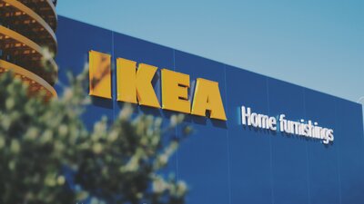 The blue exterior of an Ikea store with the yellow IKEA signage.