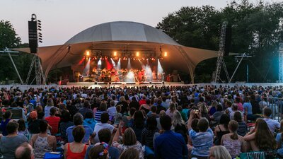 Large crowd watching free musical performance
