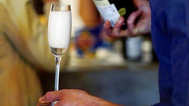 A glass of champagne being poured at Dear Prudence.