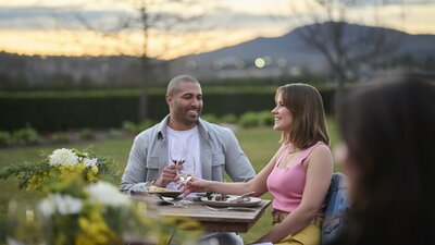 A young couple having lunch outdoors