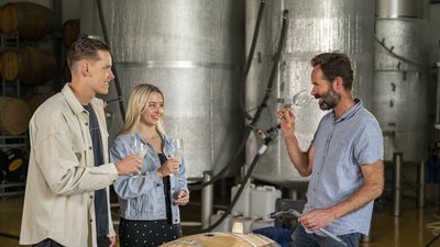 Three people tasting wine