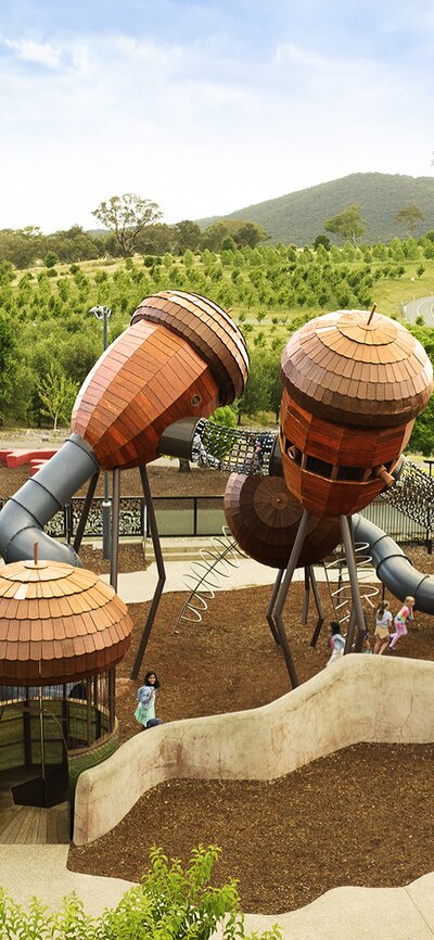 Aerial image of the Pod Playground at the National Arboretum Canberra with the arboretum and Black Mountain Tower in the background. | © Wunderman Thompson