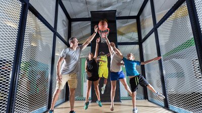 Tour group playing basketball